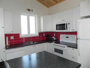 ski cottage rentals at the base of a mountain L'Anse-Saint-Jean, Saguenay-Lac-St-Jean